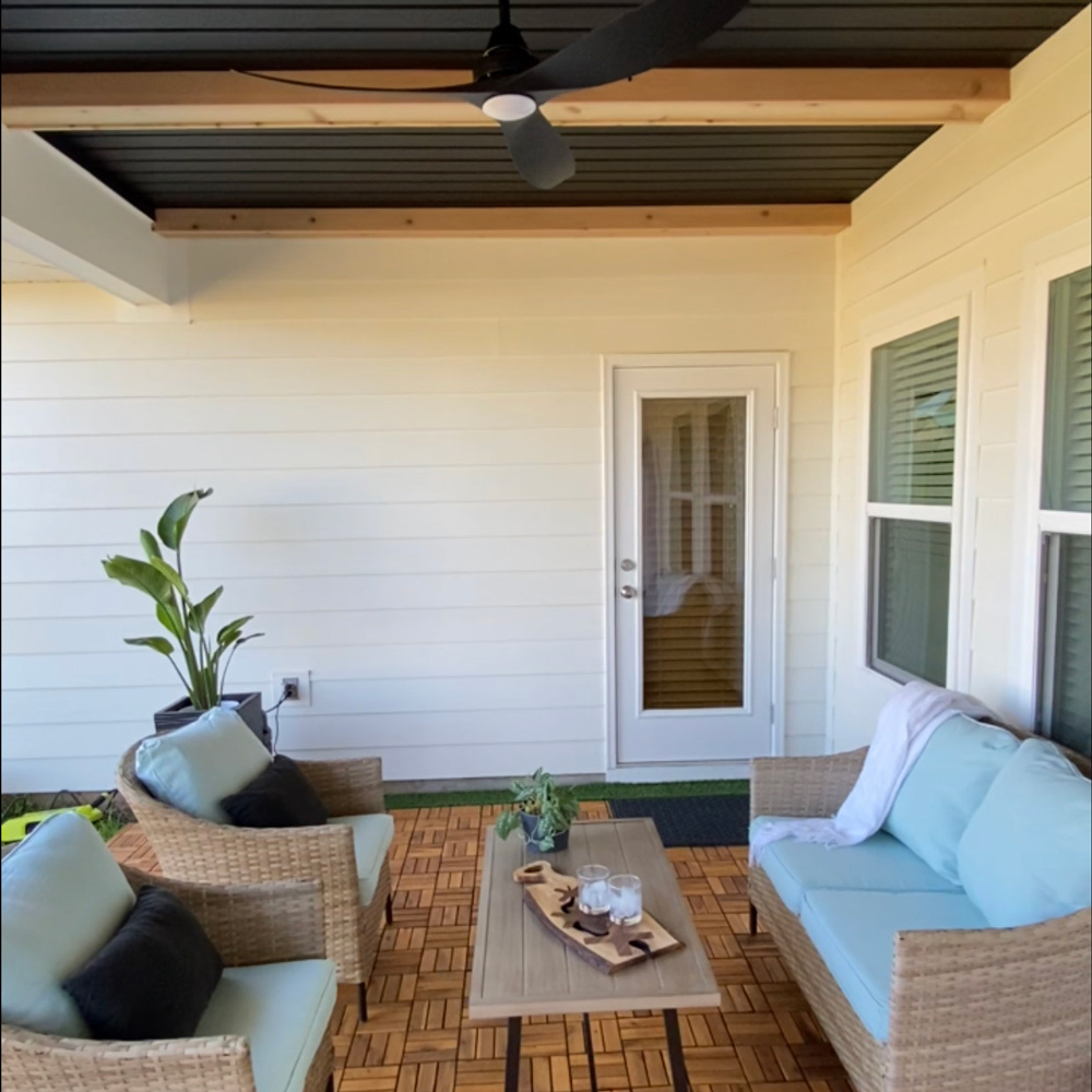 A completed patio area with a wicker conversation set. A completed patio area with a wicker conversation set.