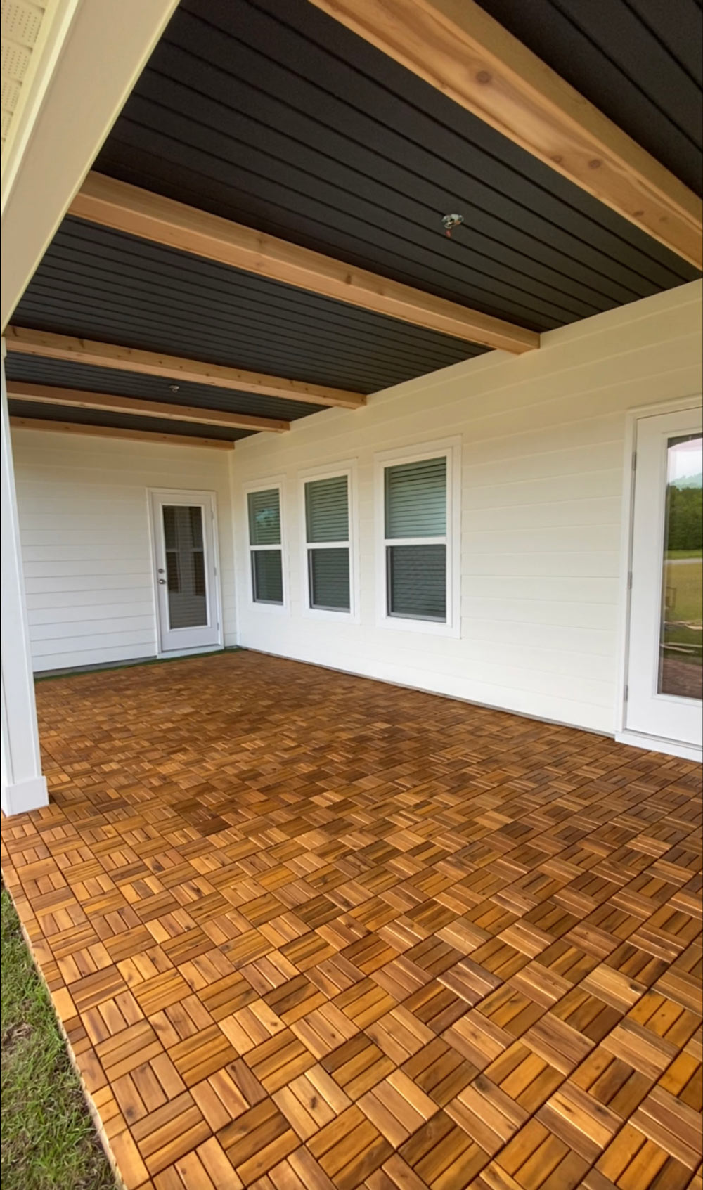 A patio completely covered with wood panel tiles. A patio completely covered with wood panel tiles.