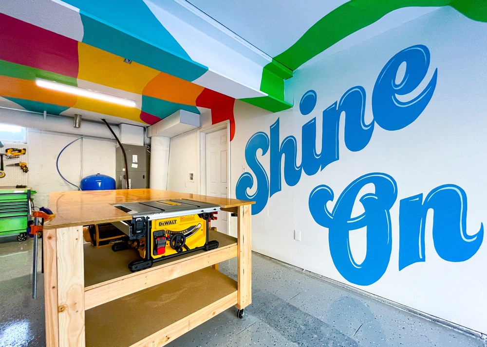 Shine on phrase painted blue on the garage wall. Shine on phrase painted blue on the garage wall.
