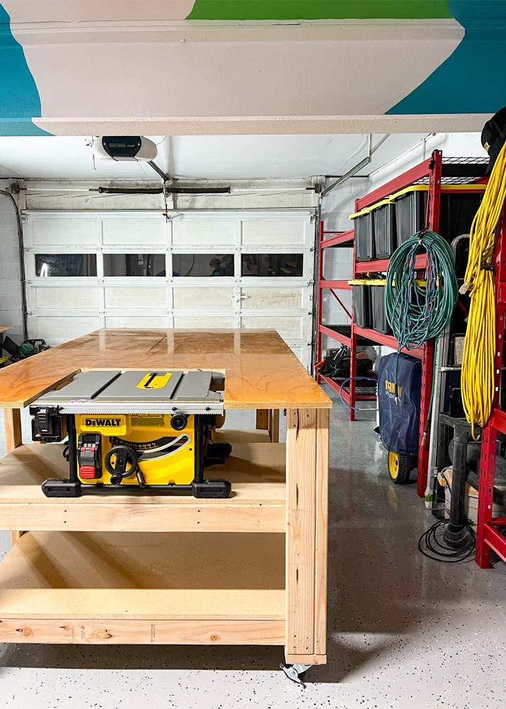 Wooden workbench in center of garage. Wooden workbench in center of garage.