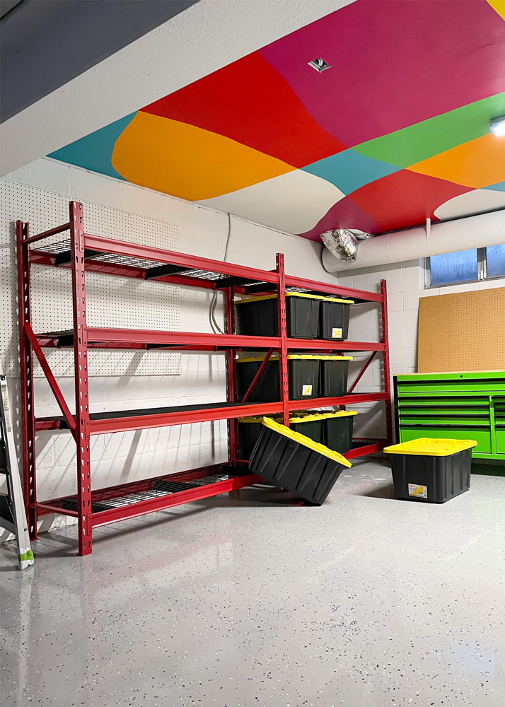Empty red shelves with totes on the floor. Empty red shelves with totes on the floor.