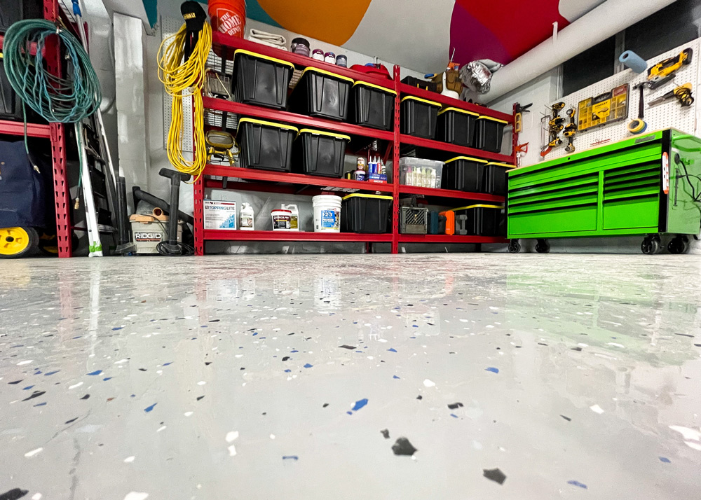 Renovated garage floor with grey and blue dots. Renovated garage floor with grey and blue dots.