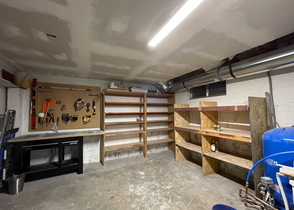 Non-renovated garage showing wooden empty shelves. Non-renovated garage showing wooden empty shelves.