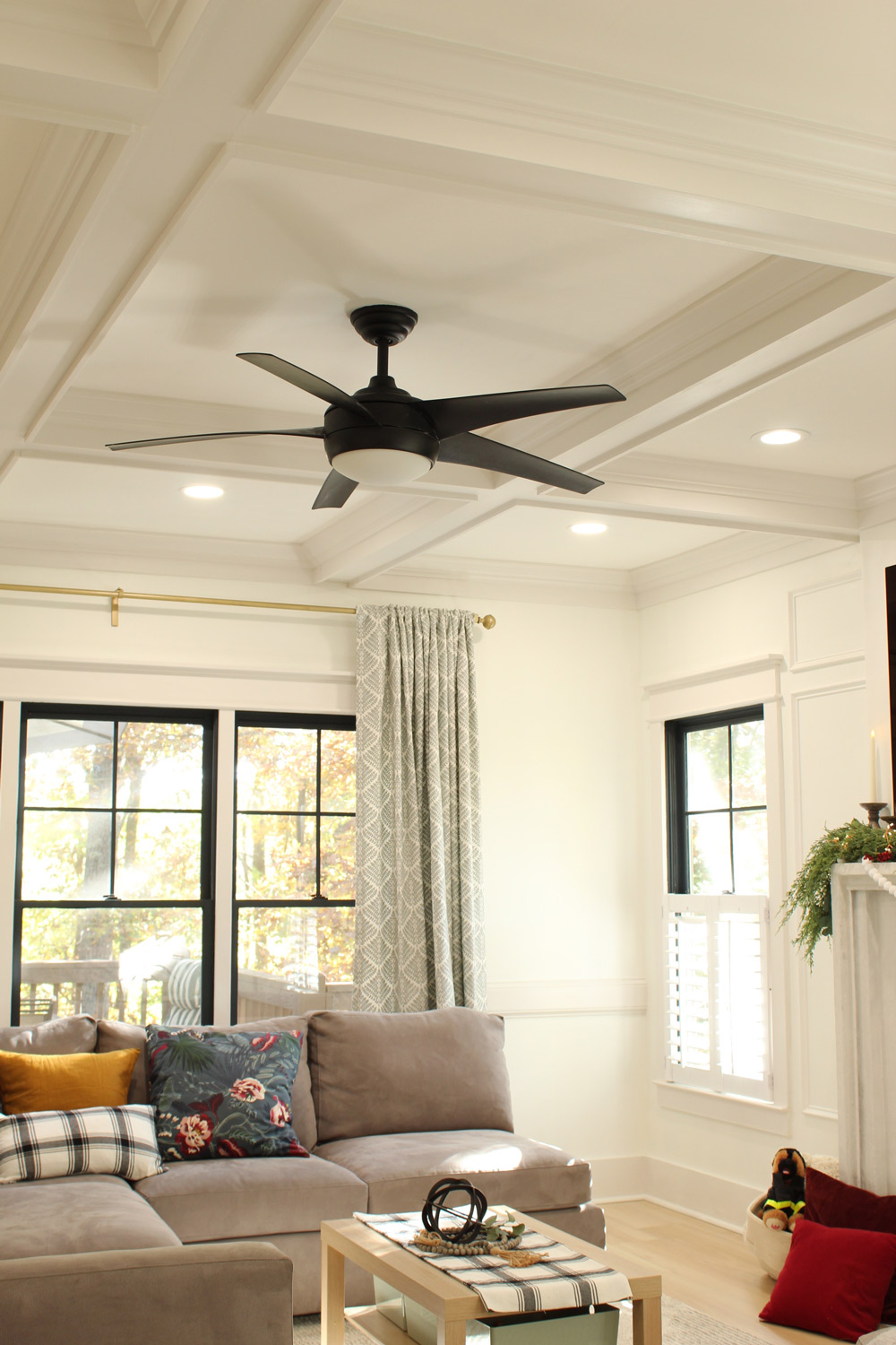 Living room ceiling featuring ceiling fan, trim and recessed lights.