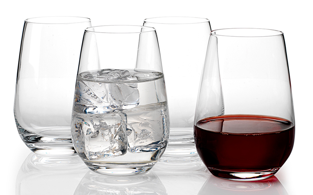 Stemless wine glasses with ice water and red wine Stemless wine glasses with ice water and red wine