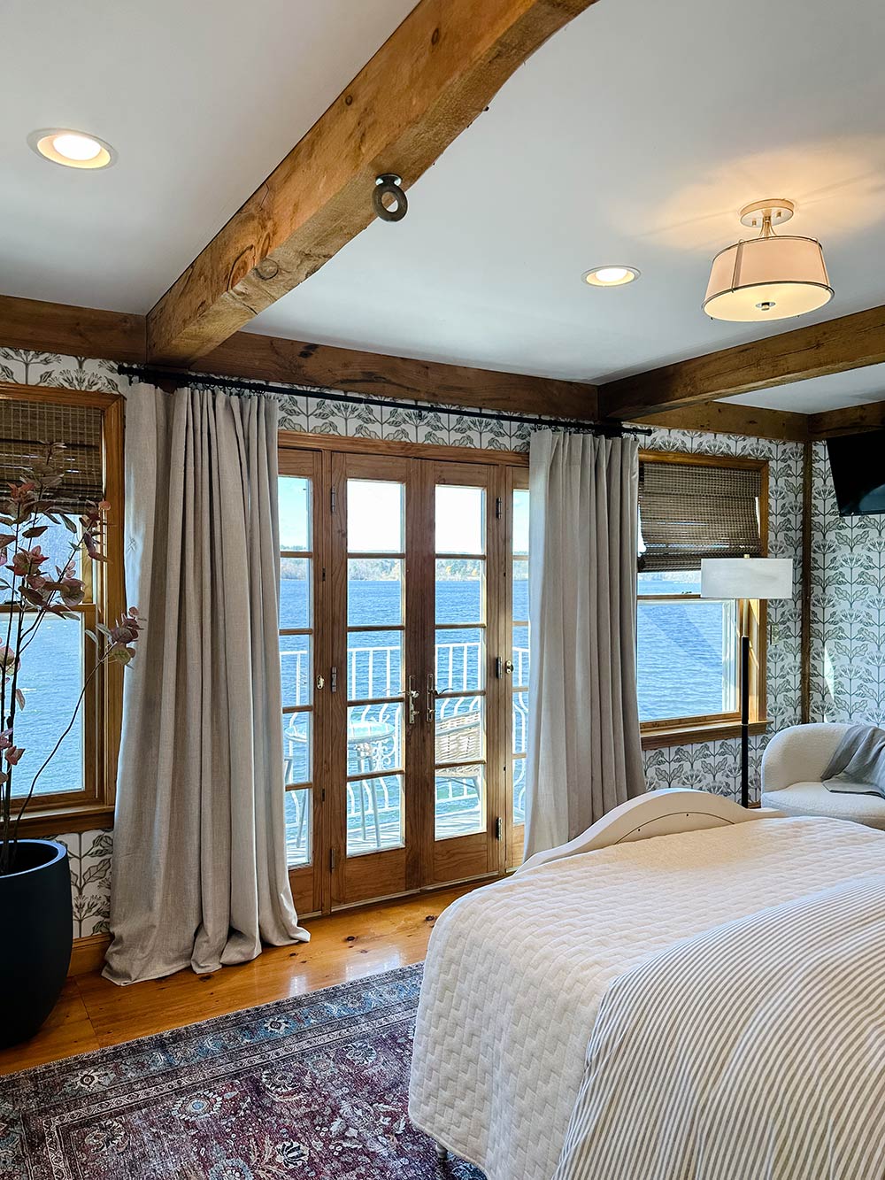 Ivory drapes around a wood door. Ivory drapes around a wood door.