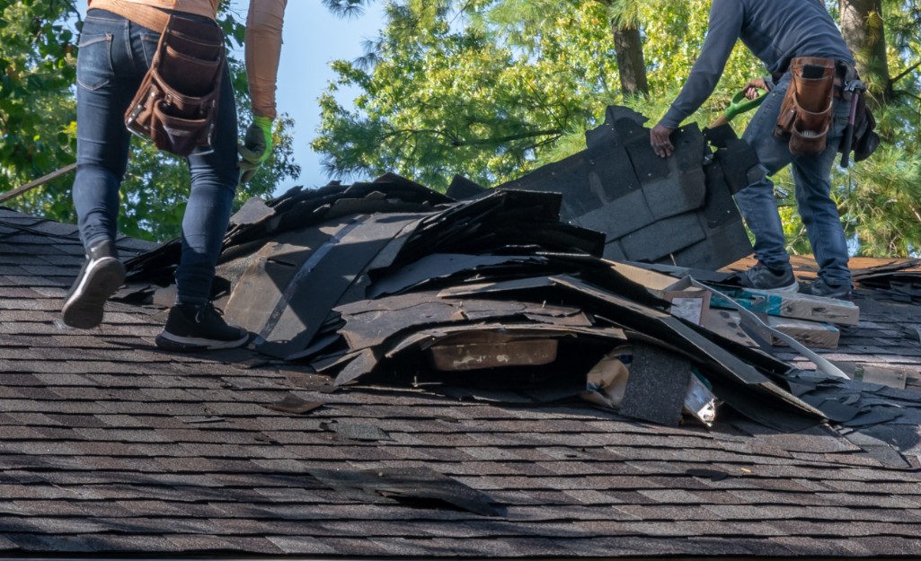 Pros repair a roof following a fire.