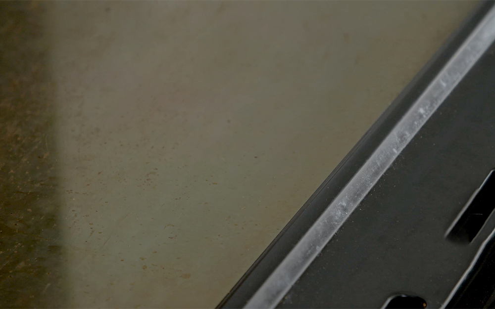 A grimy surface on a oven. A grimy surface on a oven.