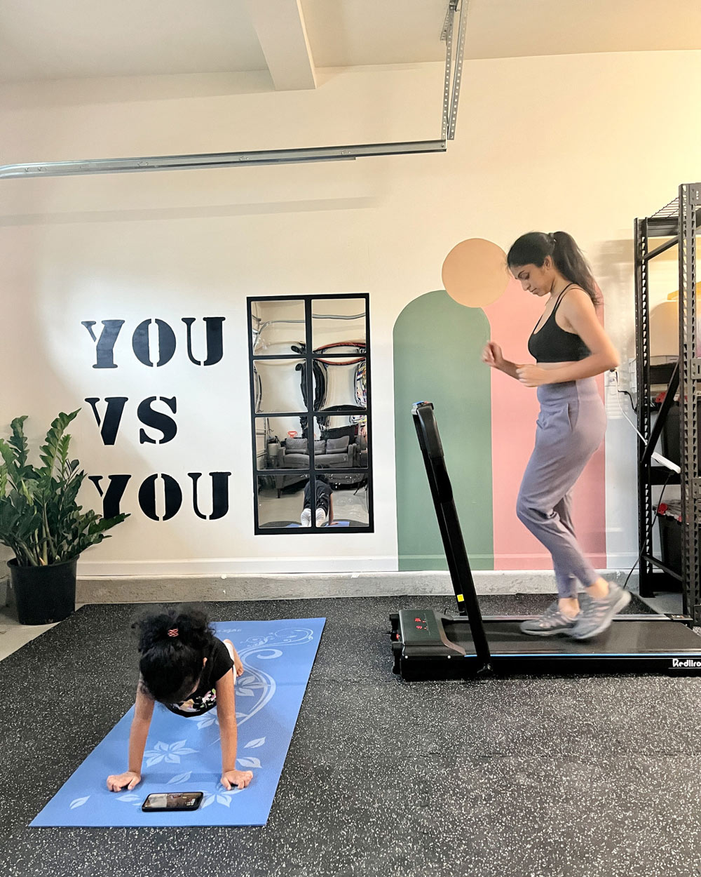 Two people using the gym space.
