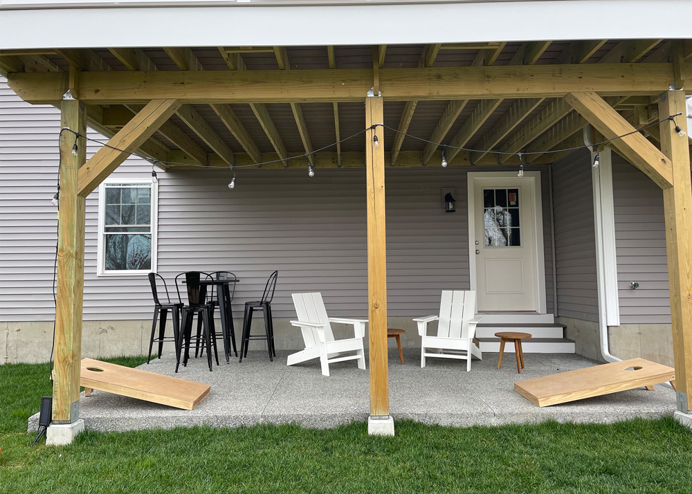 Backyard porch with chairs and tables