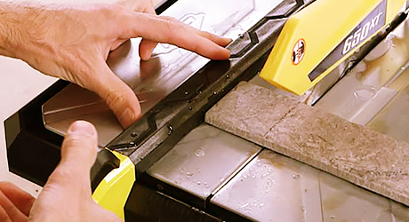 Aligning tile on table - Cut Tile Wet Saw Aligning tile on table - Cut Tile Wet Saw