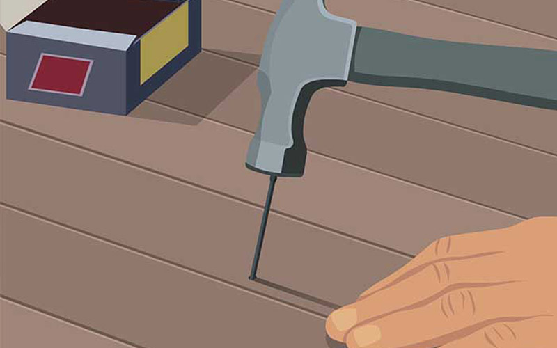 An illustration shows a nail being driven into a hardwood floor. An illustration shows a nail being driven into a hardwood floor.