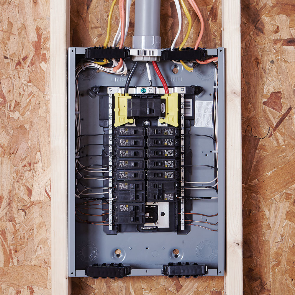 A breaker box with installed circuit breakers.