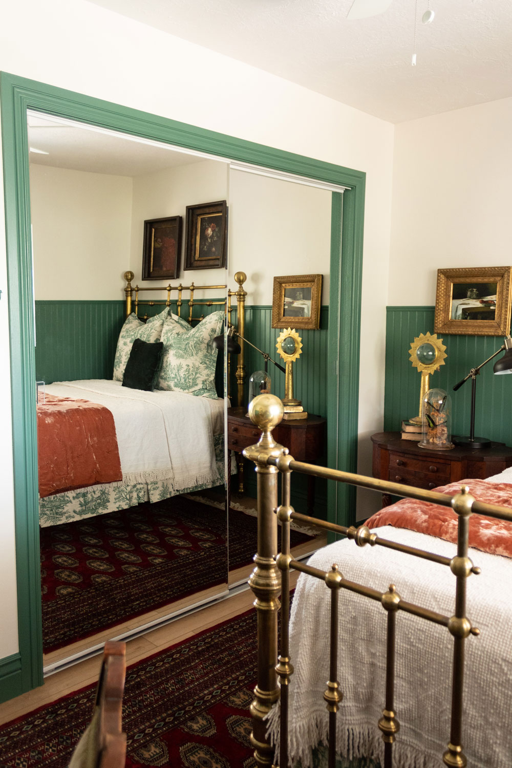 Decorated bedroom with a green trim closet.