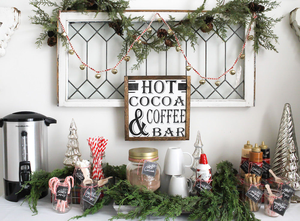 Hot Chocolate bar filled with different ingredients and a sign above that states “Hot Cocoa & Coffee Bar