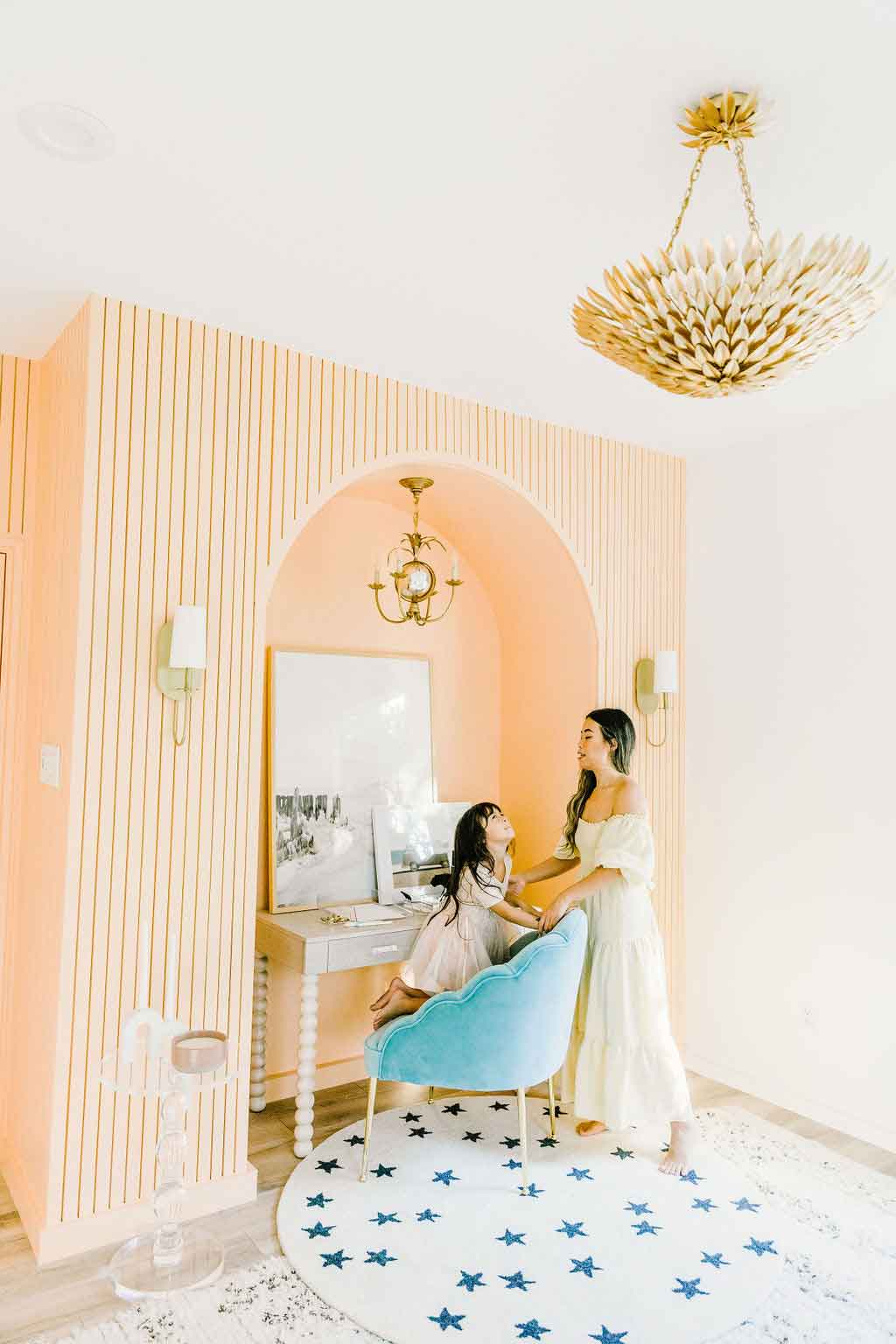 Woman and child standing under freshly painted arch Woman and child standing under freshly painted arch