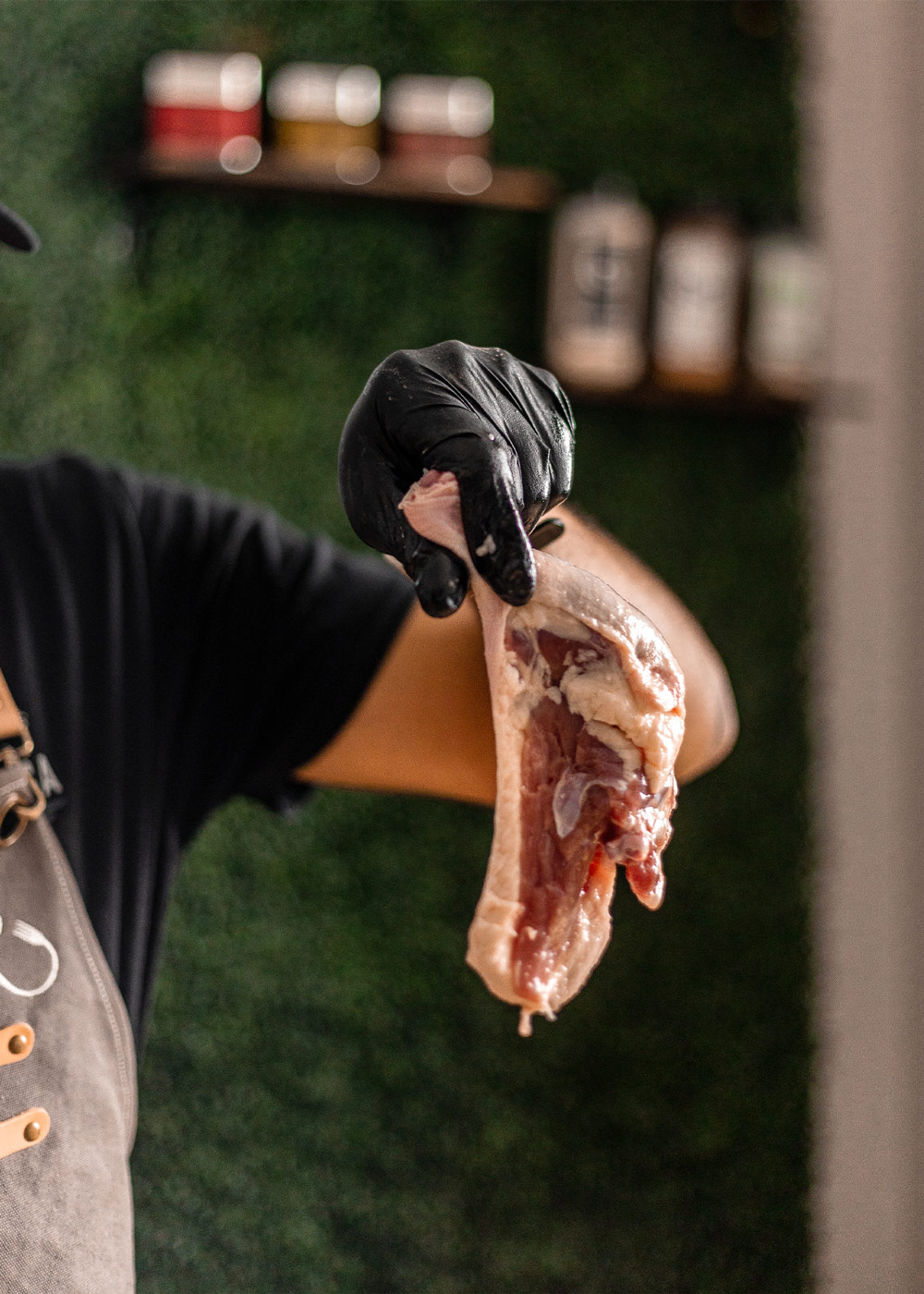 Chef holding a duck thigh. Chef holding a duck thigh.