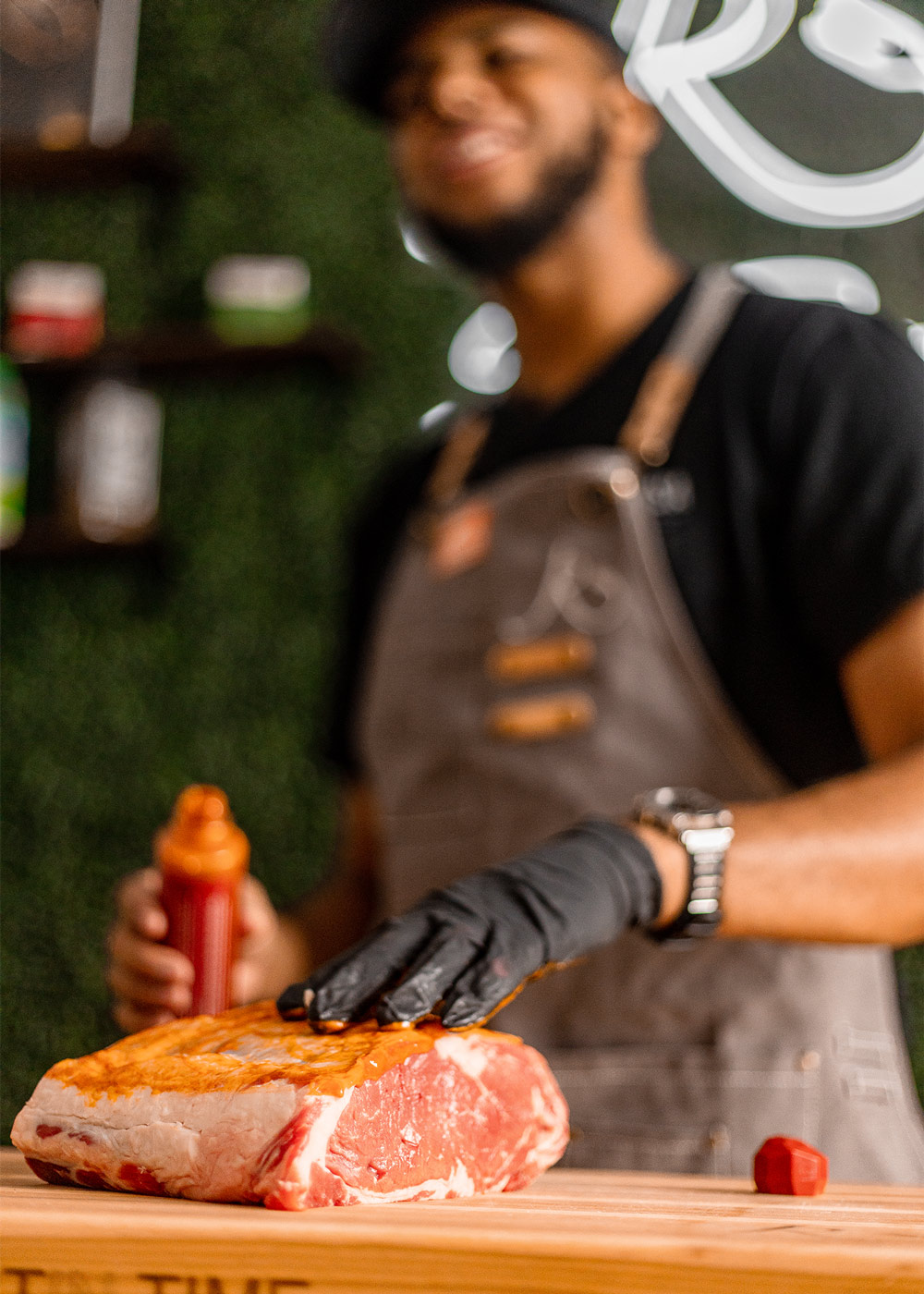 Chef seasoning ribeye roast on cutting board. Chef seasoning ribeye roast on cutting board.