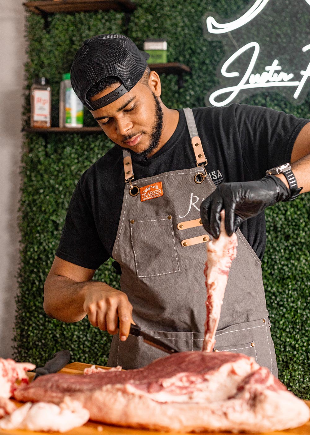 Chef trimming fat off of brisket. Chef trimming fat off of brisket.