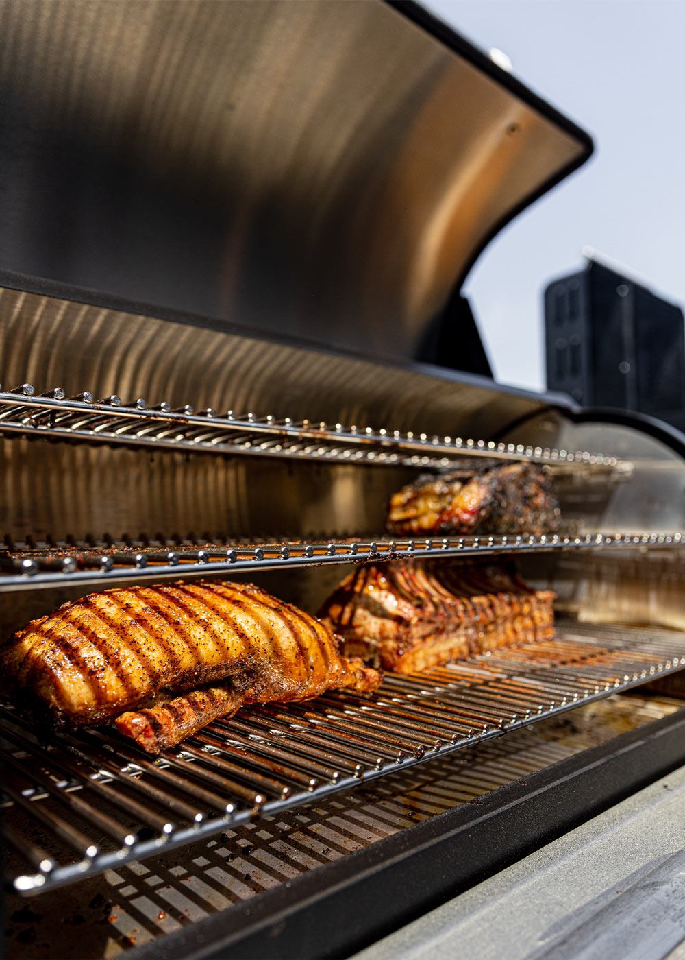 Pork loin cooking on an open grill. Pork loin cooking on an open grill.
