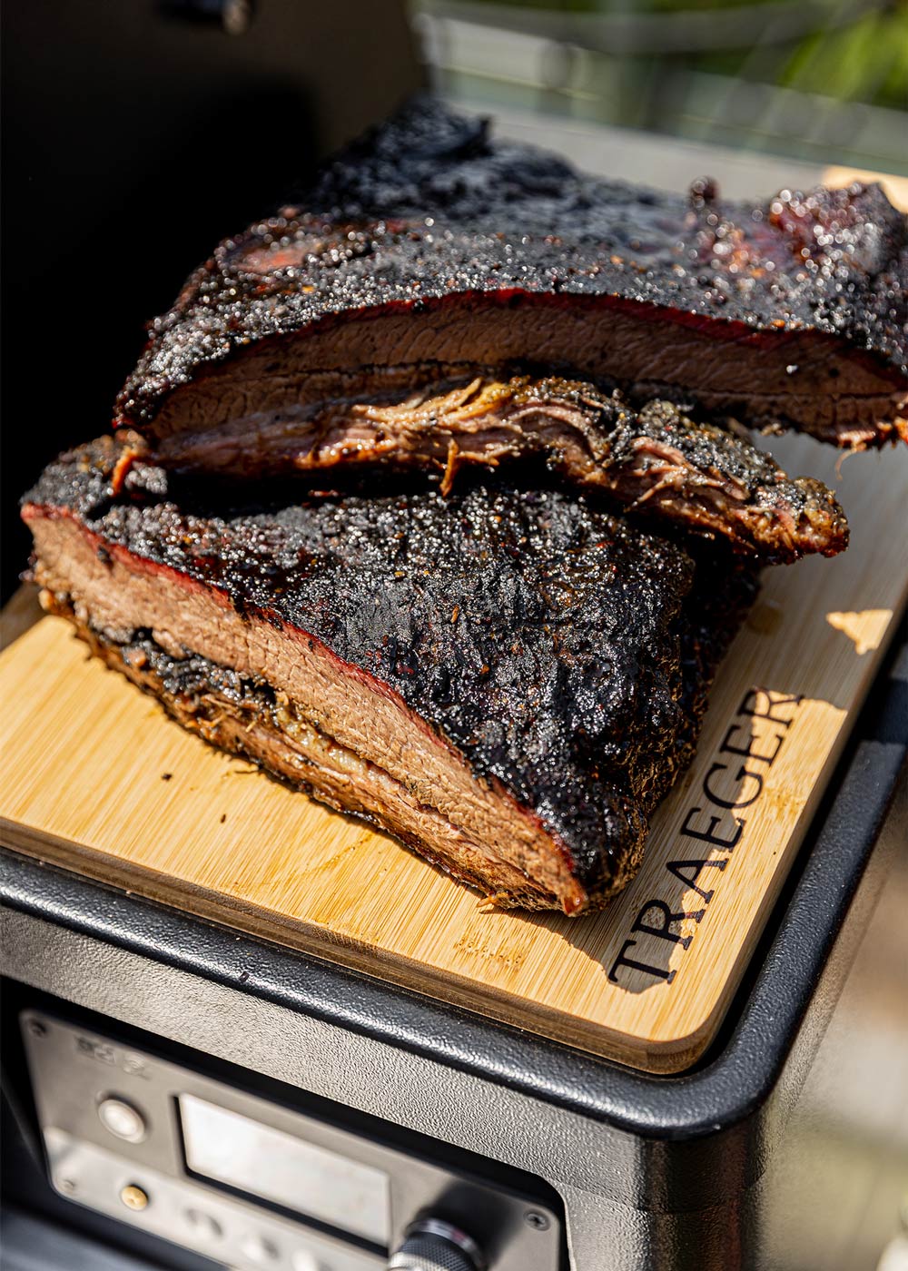 Cooked brisket resting on grill. Cooked brisket resting on grill.
