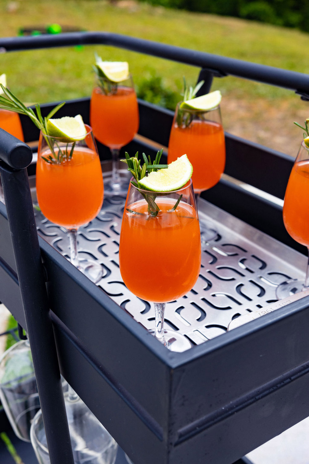 Mocktail drinks on a patterned bar cart.