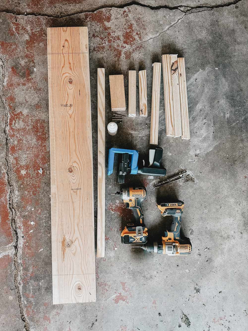 Tools and lumber laid out on the floor.