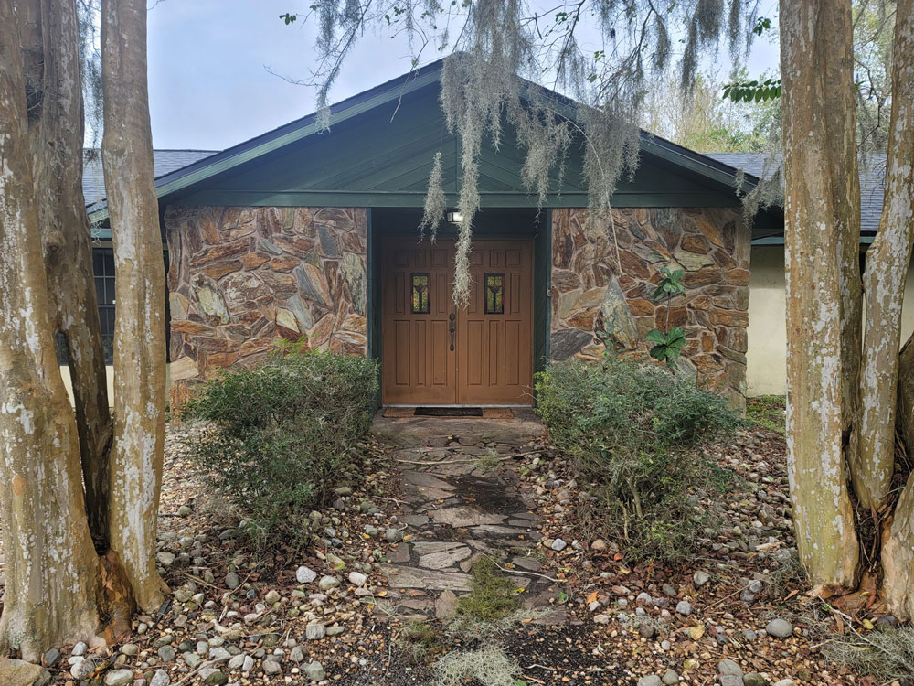 A house front with stone accents.