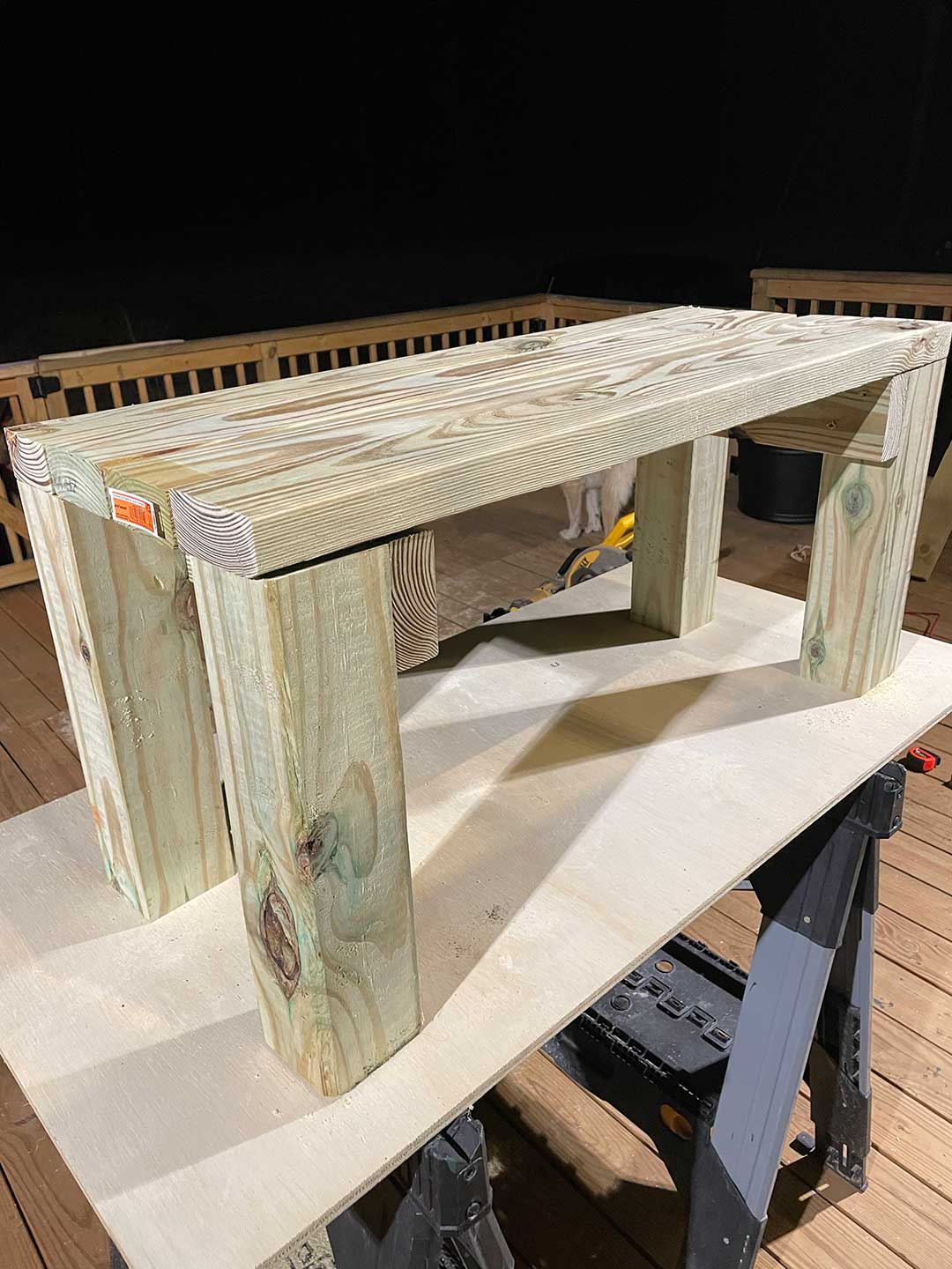 Unstained wood assembled to form a table.