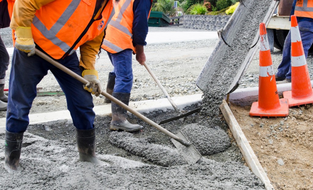 Pros use mortar hoes to pull concrete into the formwork from a chute.