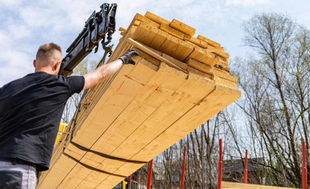 A Pro receives a delivery of boards at a build site. A Pro receives a delivery of boards at a build site.