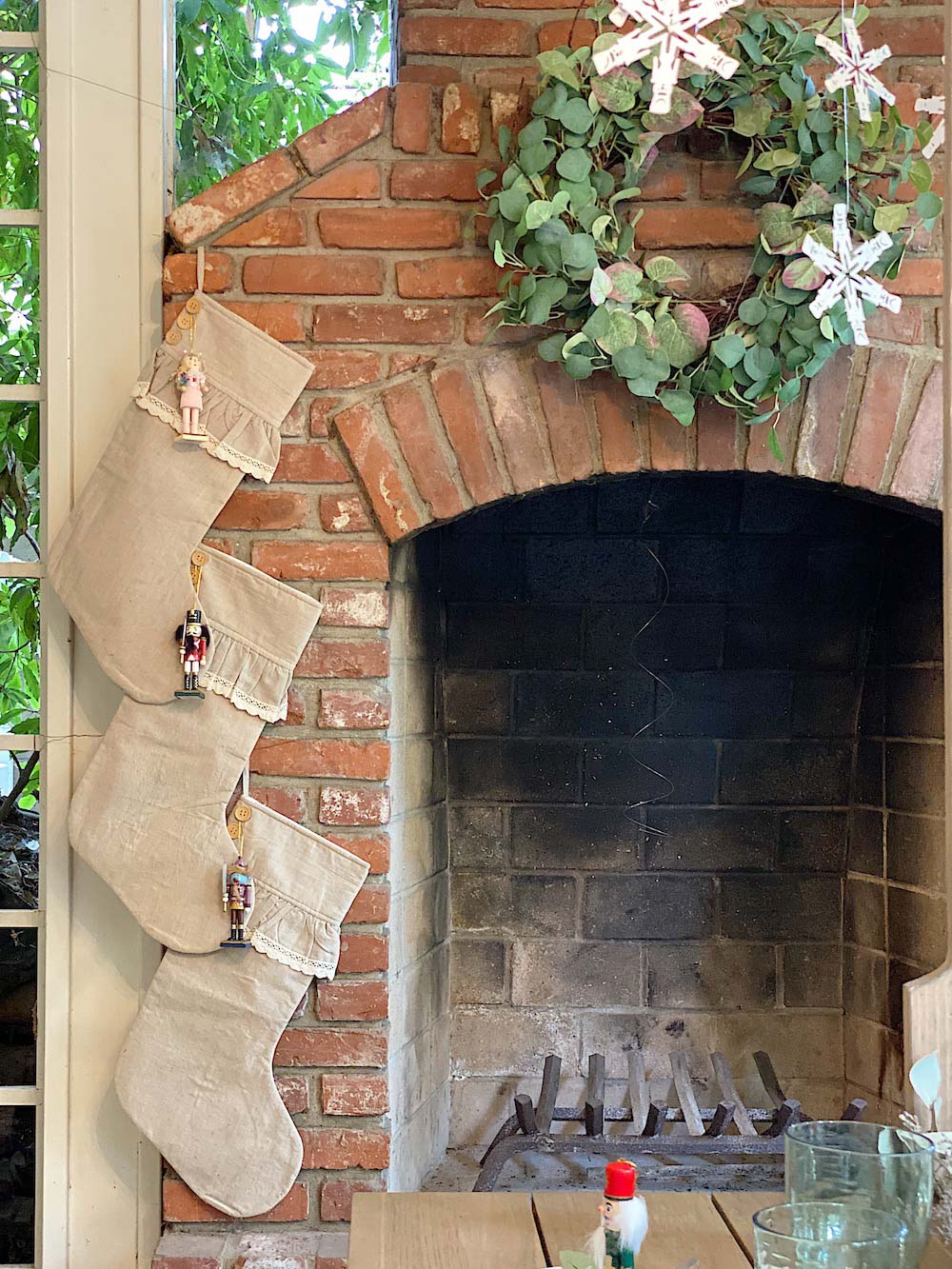  Fireplace decorated with stockings and a wreath