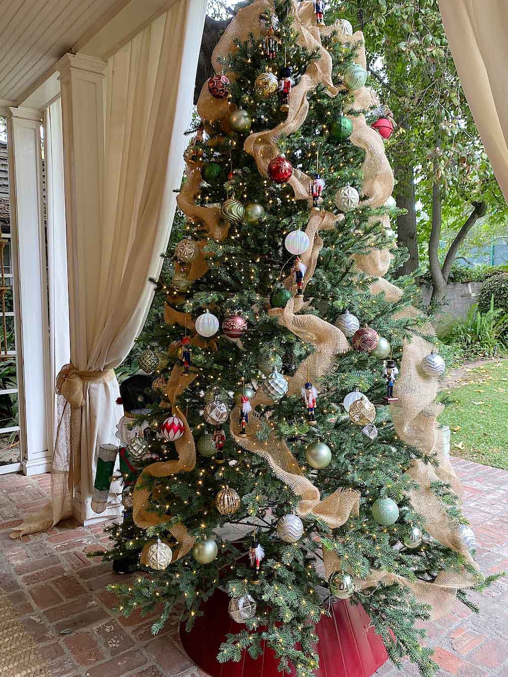 Christmas tree decorated with ornaments on patio