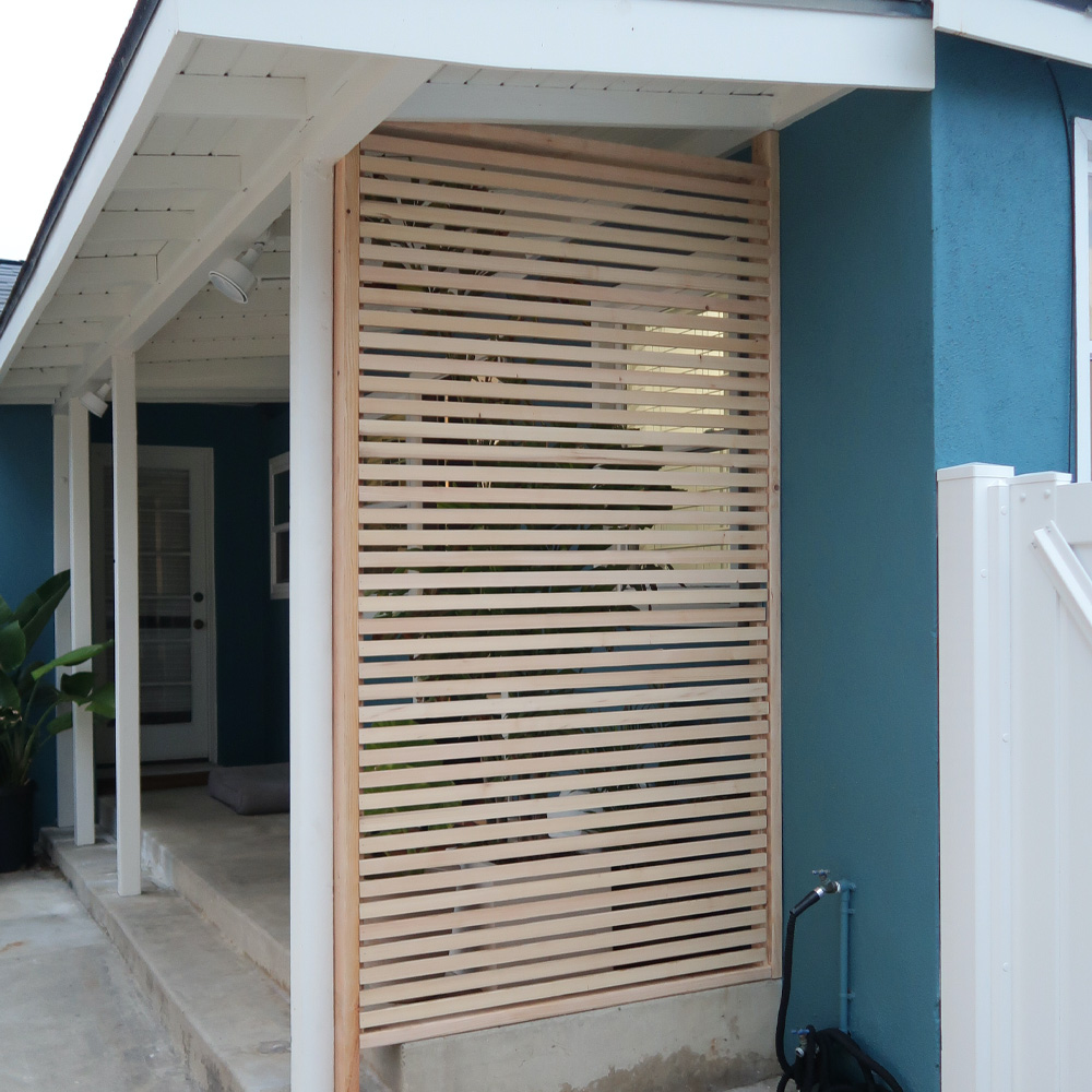  Light wood paneled privacy fence. 