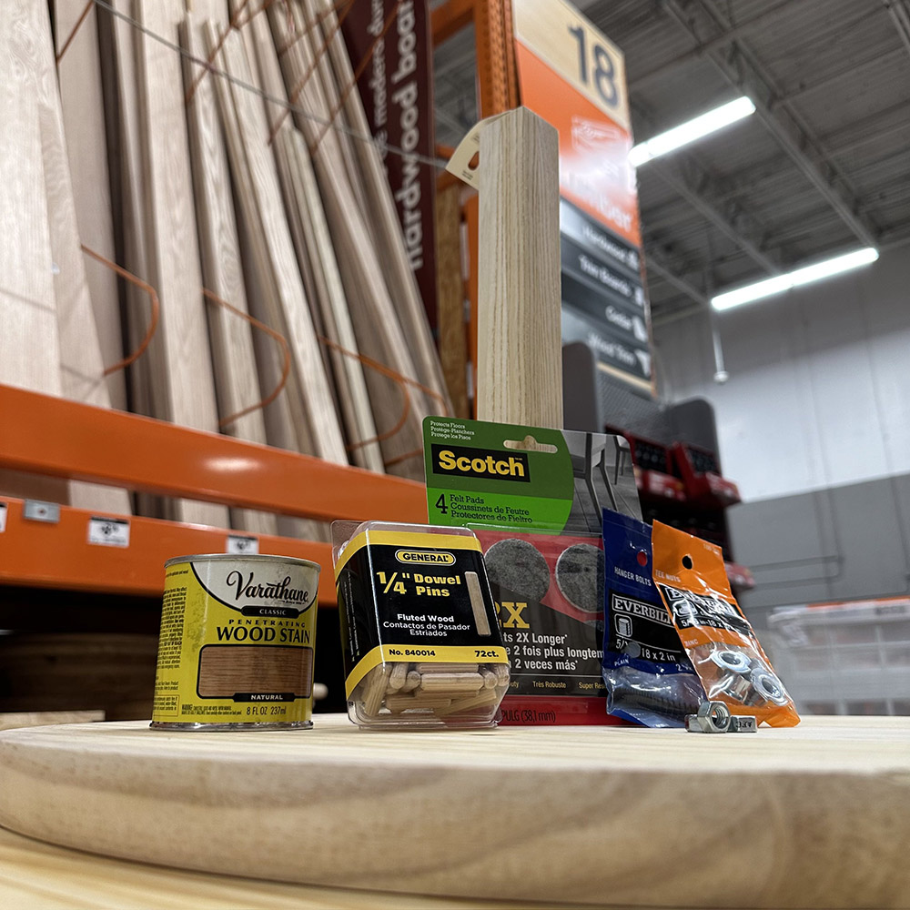 An assortment of woodworking products sitting on a plank at The Home Depot.