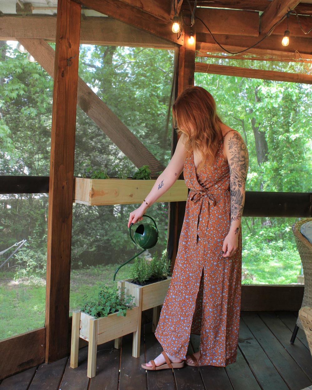 A woman watering her plants. A woman watering her plants.