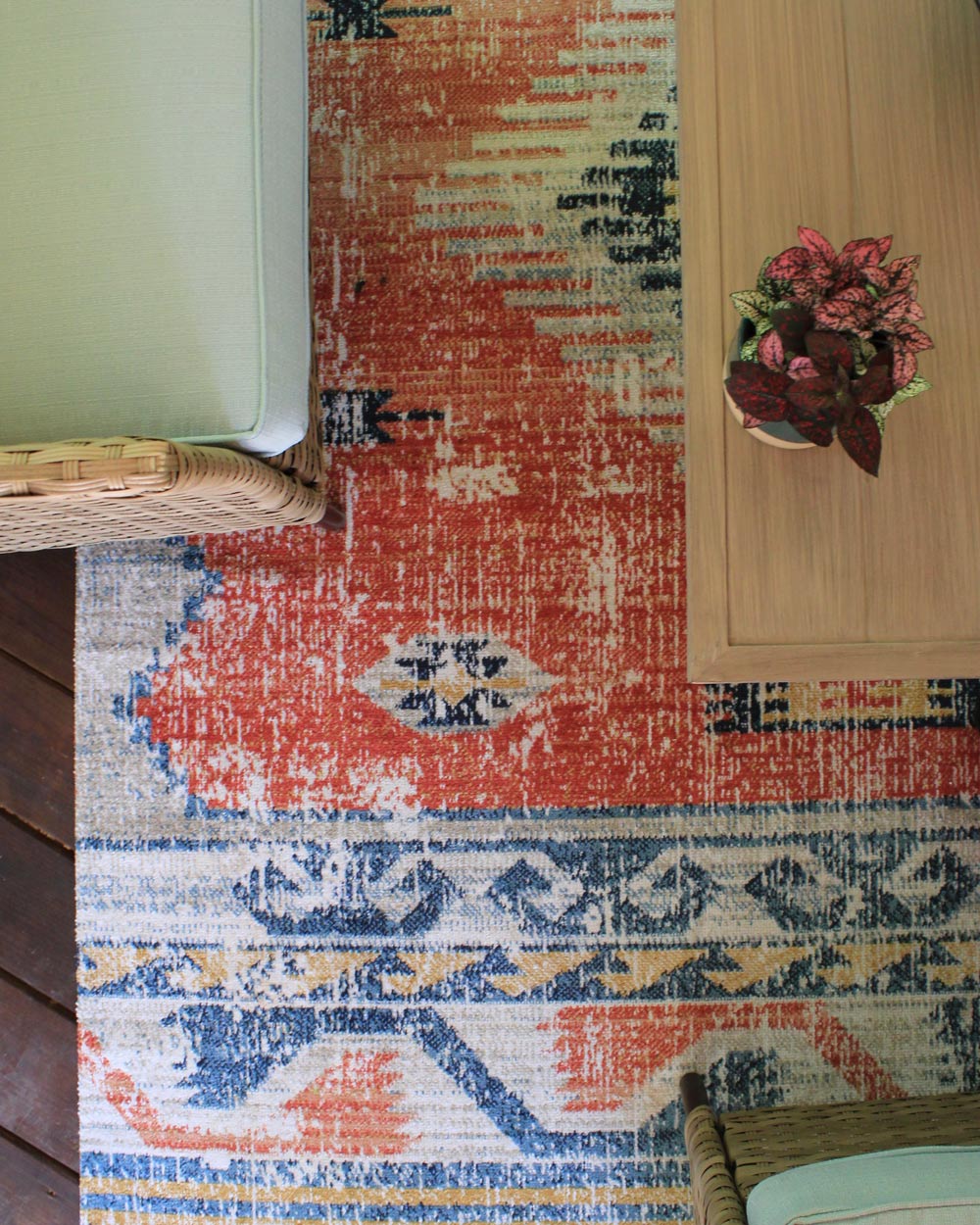 Overview of a patio set on a patterned rug. Overview of a patio set on a patterned rug.
