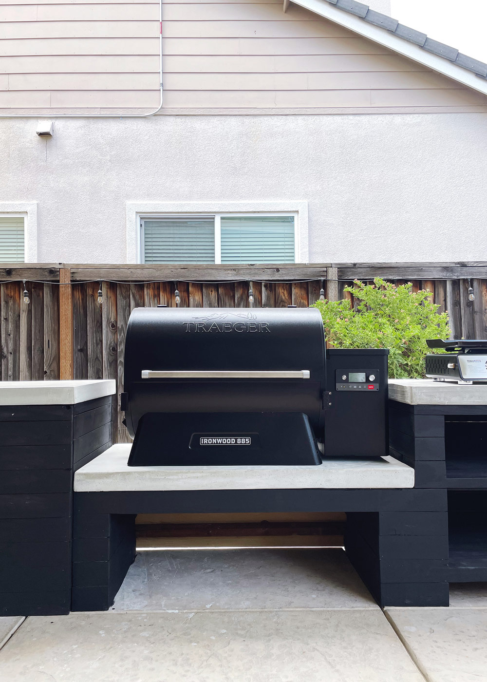 Traeger Grill placed on a DIY black and white countertop
