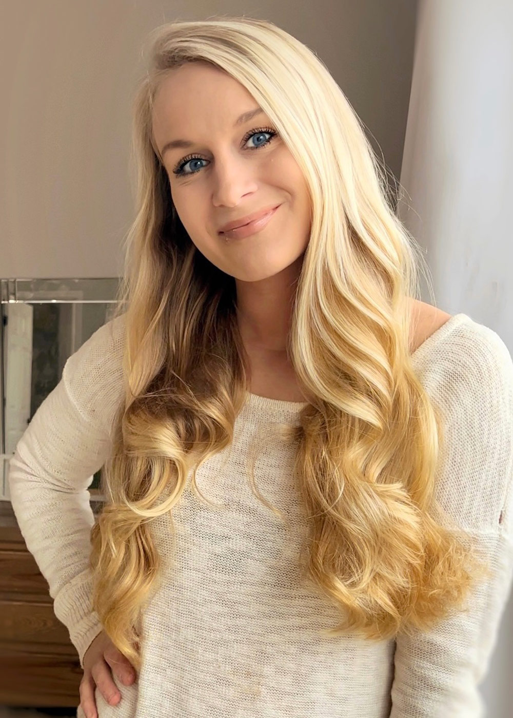 A woman standing and smiling. A woman standing and smiling.