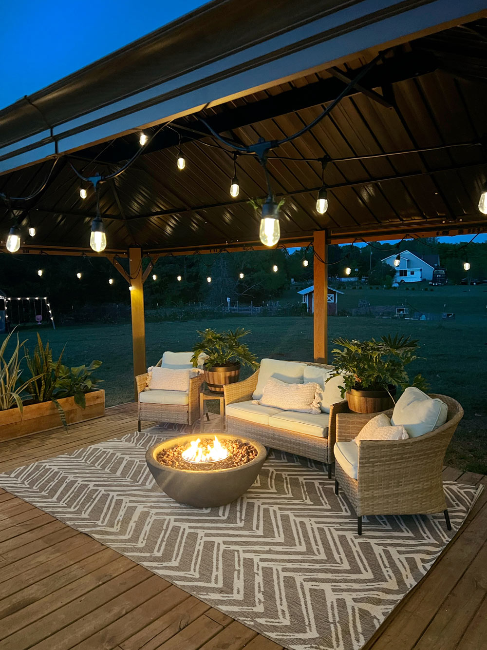 Outdoor patio area under a gazebo at night time. Outdoor patio area under a gazebo at night time.