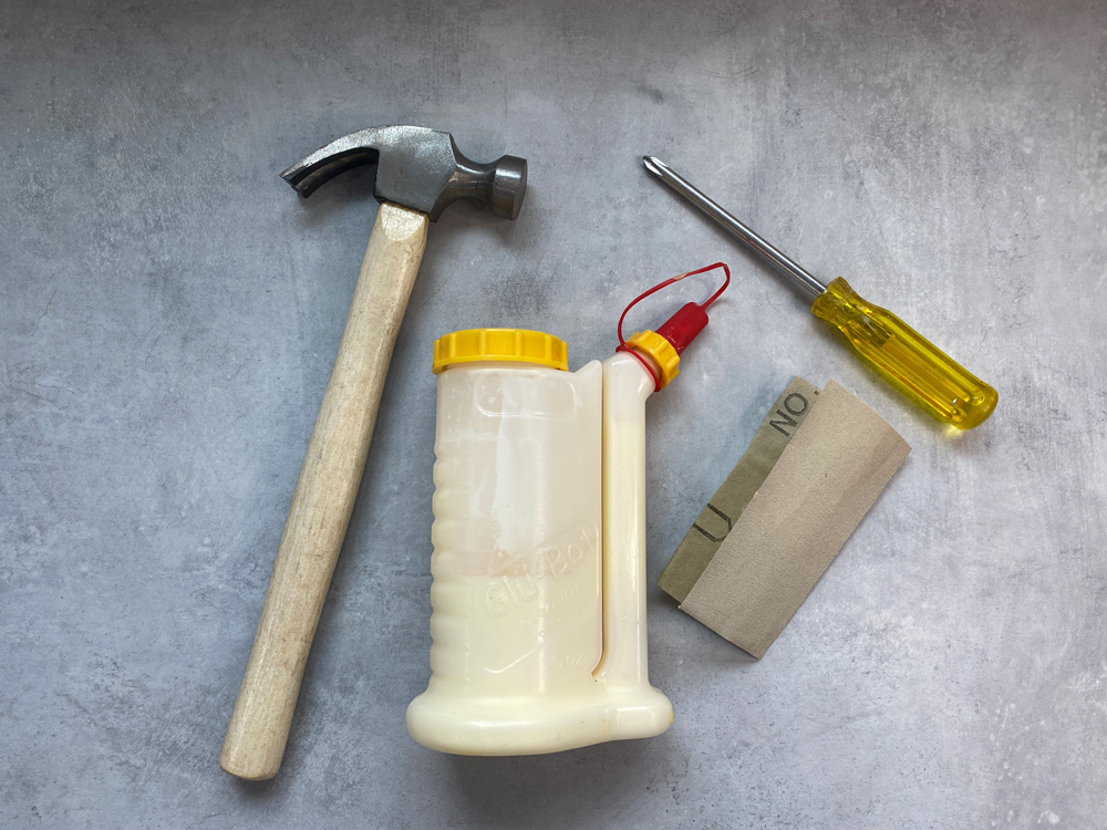 Hammer, wood glue, sandpaper, screwdriver