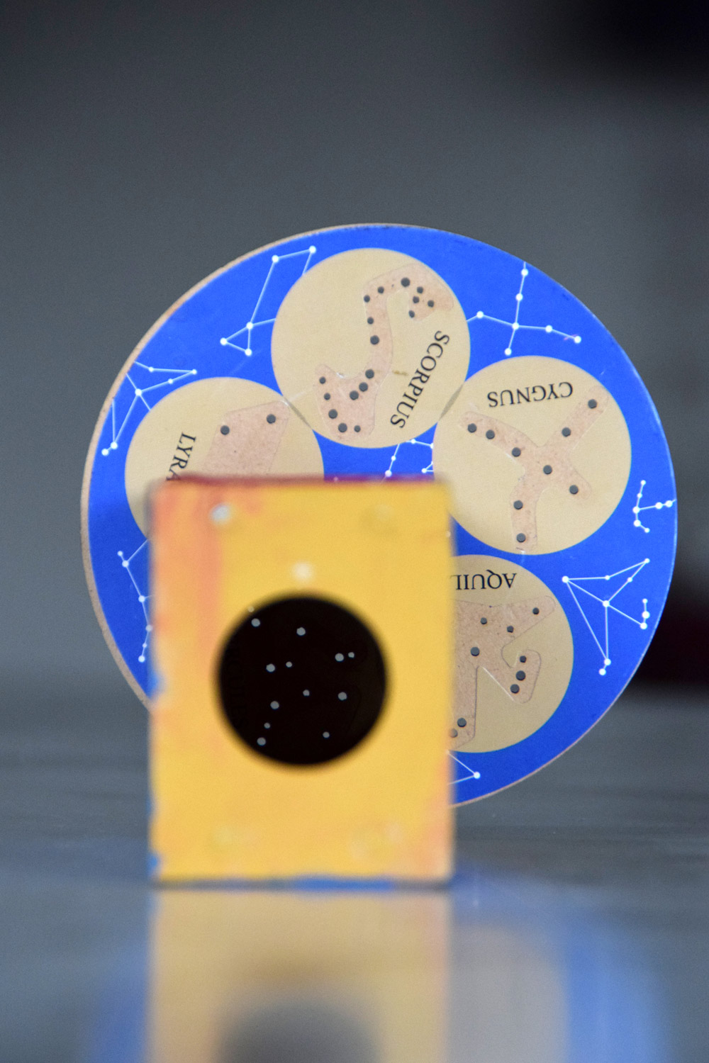 Close-up look of the inside of a constellation viewer sitting on a table.