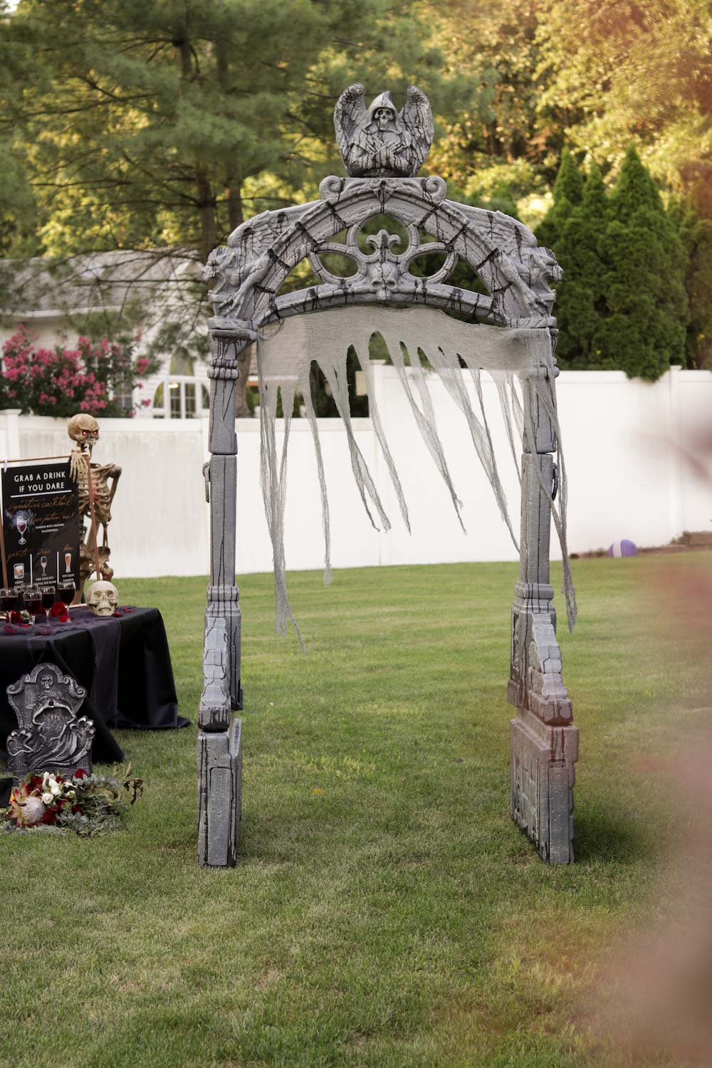 A fully assembled mausoleum archway in a yard.