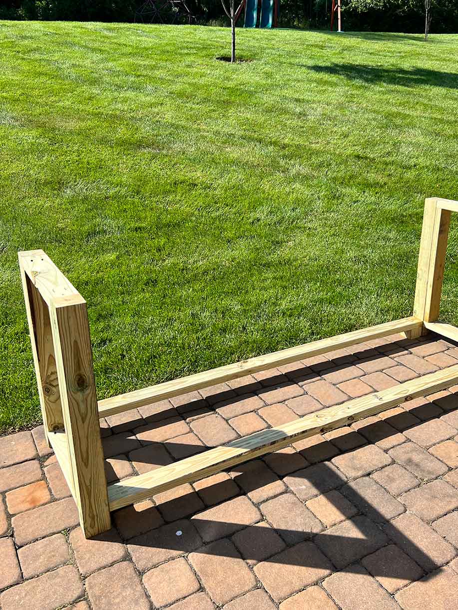 Wood outline of grill stand on the ground