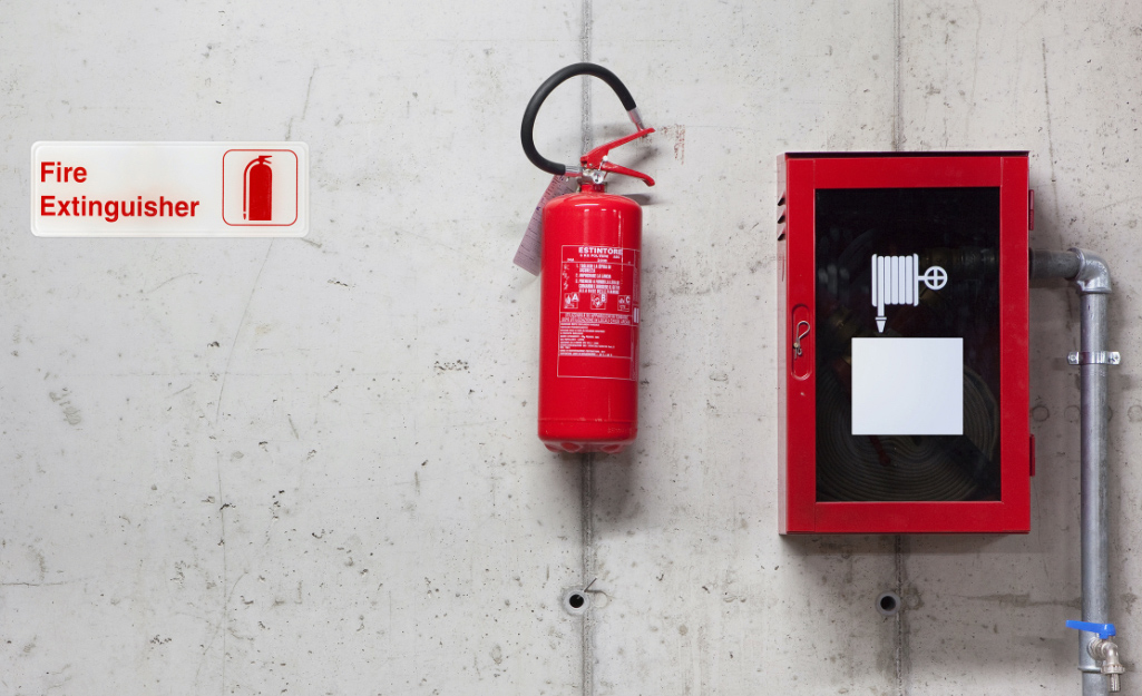 A fire extinguisher hangs on a wall.