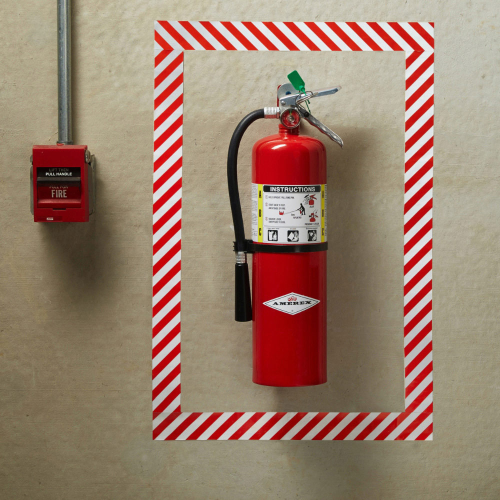 A fire extinguisher mounted on a wall.