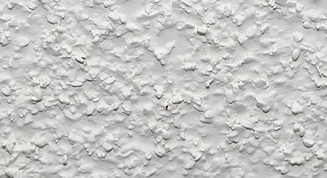 Textured surface painted in white.