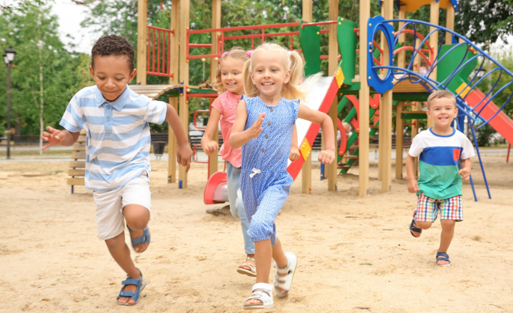 Children running a race on a playground.