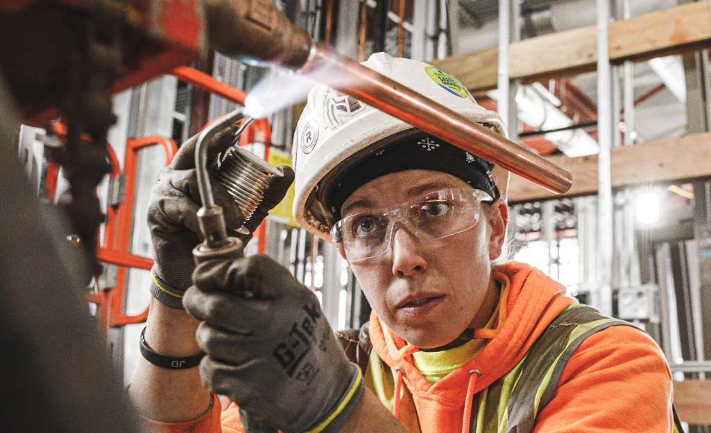 A Pro attaches copper pipe by brazing.