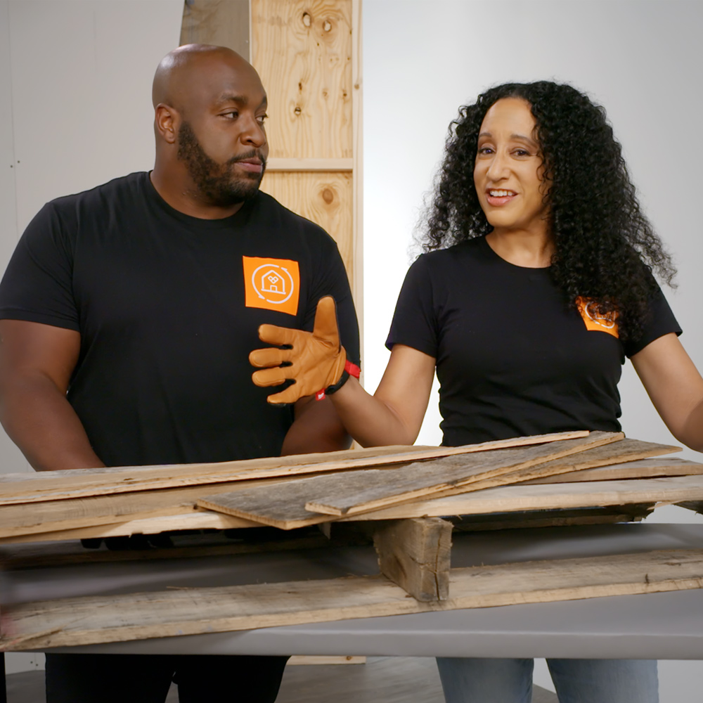 Man and woman with wood pieces. Man and woman with wood pieces.